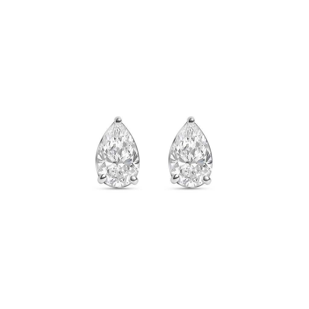 Pair of pear-shaped diamond stud earrings on a white background