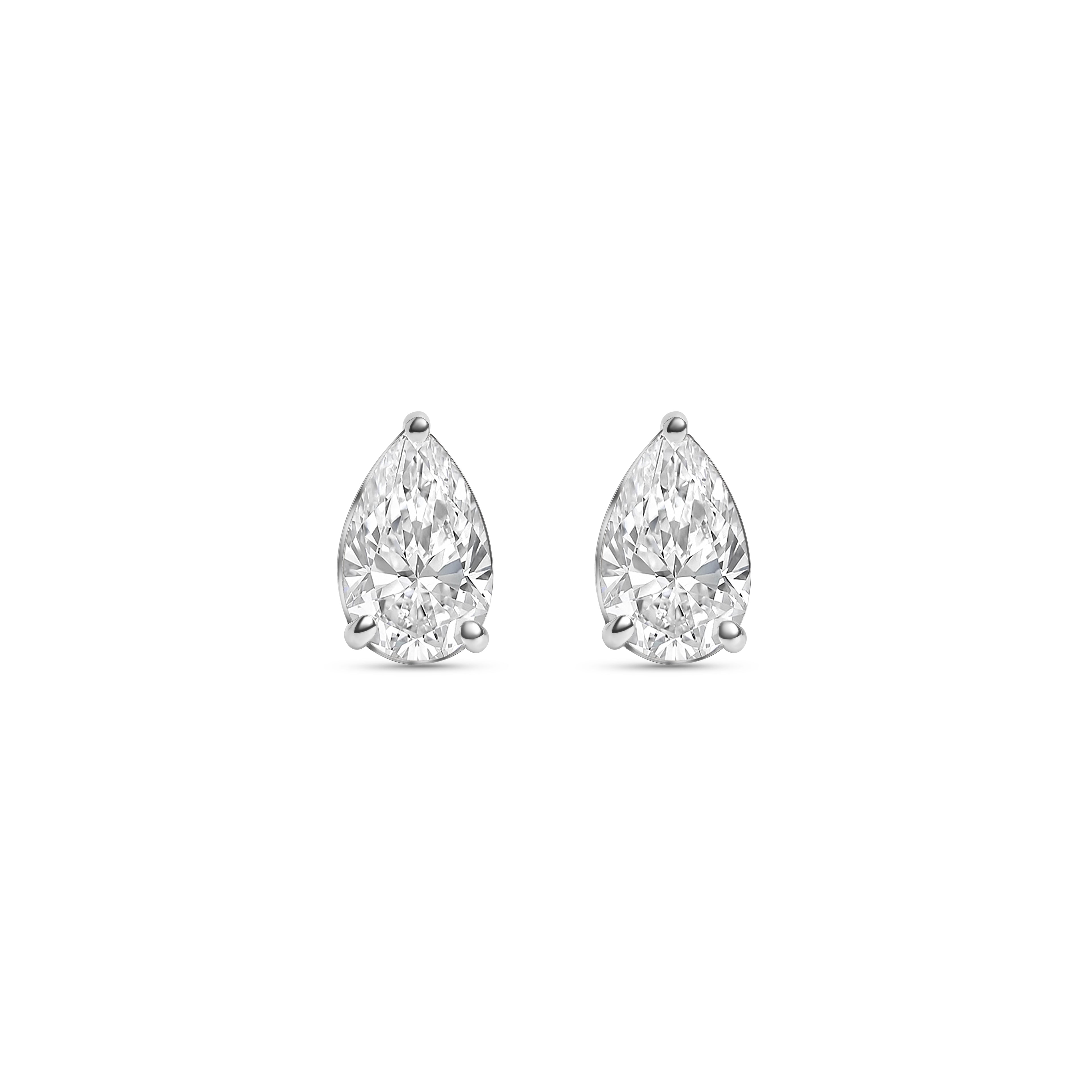 Pair of pear-shaped diamond stud earrings on a white background